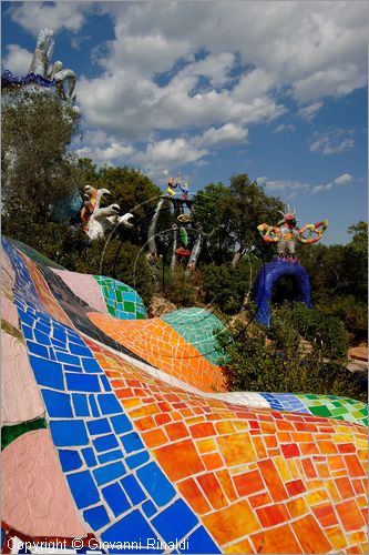 ITALY - Capalbio (GR) - località Garavicchio - Il Giardino dei Tarocchi - opera originale e fantastica ideata dall'artista francese Niki de Saint Phalle. L'opera rappresenta i 22 Arcani Maggiori dei Tarocchi realizzati con fantastiche sculture di cemento armato e poliestere, ricoperte con mosaico di ceramica , vetri e specchi