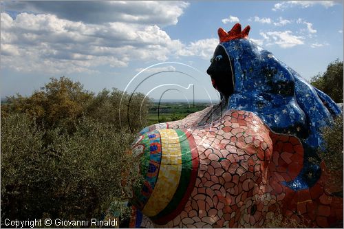 ITALY - Capalbio (GR) - localit Garavicchio - Il Giardino dei Tarocchi - opera originale e fantastica ideata dall'artista francese Niki de Saint Phalle. L'opera rappresenta i 22 Arcani Maggiori dei Tarocchi realizzati con fantastiche sculture di cemento armato e poliestere, ricoperte con mosaico di ceramica , vetri e specchi