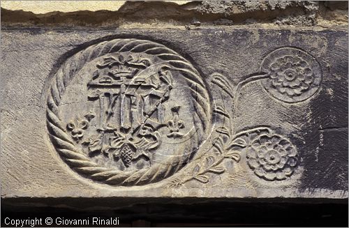 ITALY - LIGURIA - PIGNA (IM) - simbolo sacro a bassorilievo su un architrave