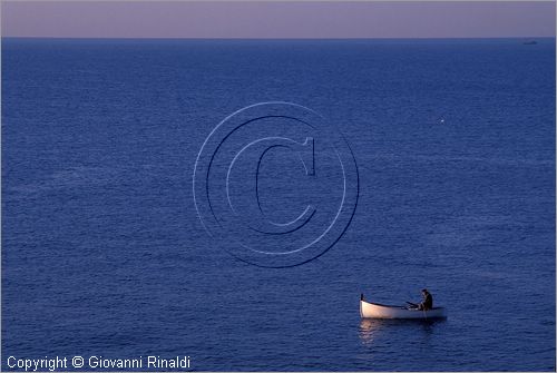 ITALY - NERVI (GE) - una piccola barca da pesca nel mare di fronte al porto