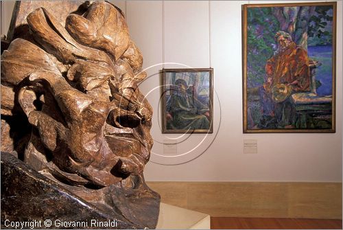 ITALY - ROMA - Galleria d'Arte Moderna - Novecento - Il tempo delle avanguardie - "antigrazioso, ritratto della madre" (1912) di Umberto Boccioni, sul fondo due quadri ("Silvia" del 1915 e "ritratto del maestro Busoni" del 1916)