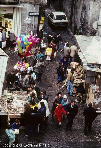 ITALY - NAPOLI - Via di San Gregorio Armeno con gli artigiani che vendono i presepi durante il natale